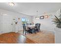 Inviting dining area with wood floors, neutral carpet, and a view to the home's front yard at 227 Sumter Ct, Burlington, NC 27217