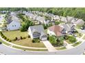 Suburban homes with manicured lawns sit nestled within a well-planned residential community at 2437 Everstone Rd, Wake Forest, NC 27587