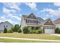 Traditional two-story home with a well-kept lawn and charming curb appeal at 2437 Everstone Rd, Wake Forest, NC 27587