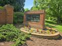 Attractive brick signage with manicured flowerbeds welcomes you to The Villages at 2565 Bent Green St, Raleigh, NC 27614
