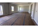 Spacious living room with neutral paint, large windows for natural light, and an open floor plan at 3529 Bailey Lake Dr, Fuquay Varina, NC 27526