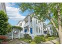 Charming two-story home with white siding, a blue front door, and a delightful garden entrance at 403 Brookgreen Dr, Chapel Hill, NC 27516