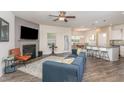 Spacious living room featuring an open floorplan, fireplace, and modern finishes at 49 Parkside Dr, Lillington, NC 27546
