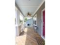 Cozy front porch featuring a swing and ceiling fan, perfect for relaxation at 507 Canal St, Durham, NC 27701