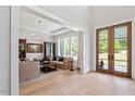 Bright living room with hardwood floors, recessed lights, neutral paint, and large windows at 5803 Vintage Oak Ln, Raleigh, NC 27613