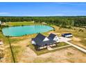 Stunning aerial view of home with pond and spacious yard, offering tranquil country living at 6185 Nc-50, Benson, NC 27504