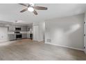 Inviting open-concept living area with updated appliances and gray cabinetry at 804 Harper Rd, Hillsborough, NC 27278