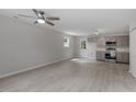 Open-concept living space featuring modern light gray walls and sleek flooring at 804 Harper Rd, Hillsborough, NC 27278