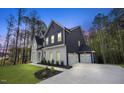 Striking two-story home featuring an attached garage and neutral paint scheme at 8237 Baronleigh Ln, Wake Forest, NC 27587