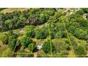 Aerial view shows home set on large wooded lot, indicated by yellow property lines at 901D Gibson Rd, Mebane, NC 27302