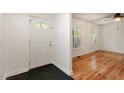 Bright entryway featuring a white front door with windows and hardwood floors at 104 Argyle Ct, Garner, NC 27529