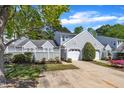 Beautiful home with gray siding, one-car garage, and a quaint fenced-in front yard space at 105 Breakers Pl, Cary, NC 27511