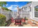 Outdoor patio space featuring a table with chairs and a closed white umbrella at 105 Breakers Pl, Cary, NC 27511