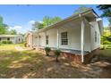 Inviting single-story home with covered front porch and brick foundation at 108 Deepwood Cir, Garner, NC 27529