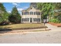 Charming two-story home with a well-maintained front yard and classic architectural details at 1832 Elkpark Dr, Raleigh, NC 27610