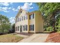 Charming two-story home featuring a driveway and a well-maintained front yard at 1832 Elkpark Dr, Raleigh, NC 27610
