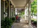Relaxing front porch with rocking chairs, perfect for enjoying the outdoors at 200 Larkhaven Pl, Apex, NC 27539