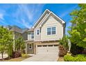 Inviting two-story home boasting an attached garage, stone accents, and fresh landscaping at 205 Begen St, Morrisville, NC 27560