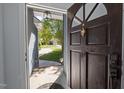 A view through the front door, showcasing the beautiful landscaping and inviting entryway at 2123 Fountain Ridge Rd, Chapel Hill, NC 27517