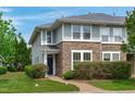 Charming townhome with a stone facade, well-maintained landscaping, and a brick walkway at 3148 Rapid Falls Rd, Cary, NC 27519