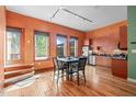 Stylish kitchen with stainless steel appliances and a dining area with natural light at 323 W Main St # C, Durham, NC 27701