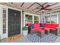 Cozy screened porch featuring comfortable outdoor seating at 3902 Booker Ave, Durham, NC 27713
