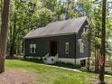 Charming home with a well-manicured lawn and a lovely exterior, surrounded by mature trees at 4521 Briarglen Ln, Holly Springs, NC 27540