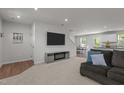 View of the light and airy living room with stylish furnishings, open floor plan, and modern decor at 473 Lavatera Dr, Wendell, NC 27591