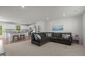 Spacious living room featuring neutral decor, an open floor plan, and plush seating at 473 Lavatera Dr, Wendell, NC 27591