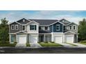 Row of townhomes featuring varied color schemes, single garages, and manicured lawns at 503 Eastwood St, Durham, NC 27703