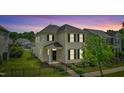 Charming two-story home featuring a fenced yard and inviting front entrance at 704 Moonbeam Dr, Raleigh, NC 27603