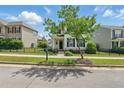 Beautiful home with dark shutters, green lawn, and black metal fence at 704 Moonbeam Dr, Raleigh, NC 27603