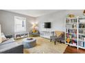 Cozy living room featuring a plush rug, comfortable seating, and natural light, creating a relaxing atmosphere at 1003 E Club Blvd, Durham, NC 27704