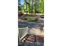 View from the porch looking at the circular driveway and landscaped front yard at 113 Colonial Dr, Wendell, NC 27591