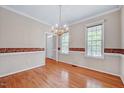 The dining room features hardwood floors, and a decorative border along the wall at 123 Alan Ln, Clayton, NC 27520