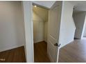 View of a walk-in closet with wire shelving and neutral carpeting at 152 Bruce Dr, Dunn, NC 28334