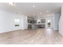 Spacious kitchen with gray cabinets, stainless steel appliances, a center island, and hardwood floors at 152 Bruce Drive Dr, Dunn, NC 28334