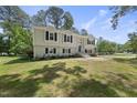 Charming exterior of a two-story house with a well-maintained lawn and lovely curb appeal on a sunny day at 1532 Cone Ave, Apex, NC 27502