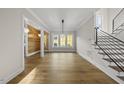 Bright living room with hardwood floors and modern staircase at 1904 French Dr, Raleigh, NC 27612