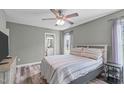 Cozy bedroom featuring soft natural light, ceiling fan, with hardwood floors at 205 Twin Oaks Dr, Angier, NC 27501