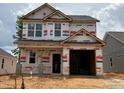 New construction home featuring a two-story design and an attached garage at 251 Bluejay St, Clayton, NC 27520