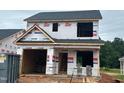 Image of a new two-story home under construction with visible framing and exterior wrap at 256 Bluejay St, Clayton, NC 27520