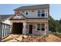 New two-story home featuring a garage and an unfinished yard at 256 Bluejay St, Clayton, NC 27520