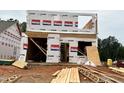 New home under construction, showcasing the framing and Westan Homes housewrap, offering a glimpse into the building process at 263 Bluejay St, Clayton, NC 27520