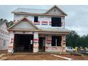 Image of a two-story home under construction, showcasing the framing and initial stages of the build at 263 Bluejay St, Clayton, NC 27520