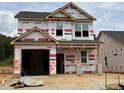 New construction home featuring a two-car garage and traditional architecture at 268 Bluejay St, Clayton, NC 27520