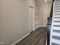 Bright entryway with practical storage, bench, and durable wood-look flooring at 3020 Freewinds Way # 47, Cary, NC 27519