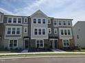 Eye-catching townhome featuring varied textures and ample window light at 3020 Freewinds Way # 47, Cary, NC 27519