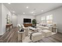 Bright living room with neutral décor, plush seating, and ample natural light at 3231 Pelican Ln, Durham, NC 27703