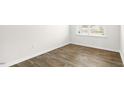 Cozy bedroom featuring neutral walls and durable flooring, ready for personalization at 404 Ember St, Sanford, NC 27330